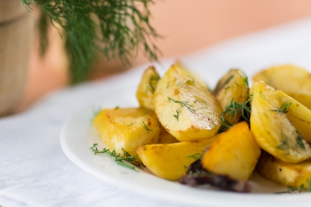 fried potatoes with bacon and dillの写真素材