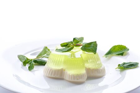 dairy and fruit jelly in a dish on a white backgroundの写真素材