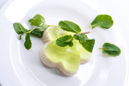 dairy and fruit jelly in a dish on a white backgroundの写真素材