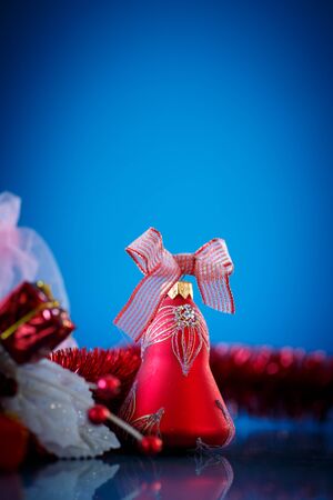 red Christmas ball on a blue backgroundの写真素材