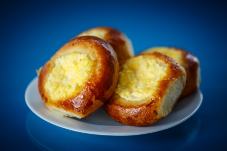 sweet homemade cheesecake with cream cheese on a blue backgroundの写真素材