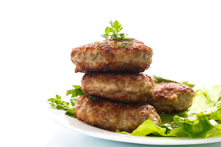 fried meatballs with herbs on white backgroundの写真素材