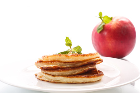 fried fritters with apples on a white backgroundの写真素材
