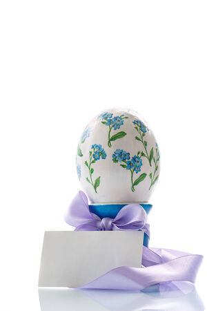 Easter egg made in the style of decoupage on a white backgroundの写真素材