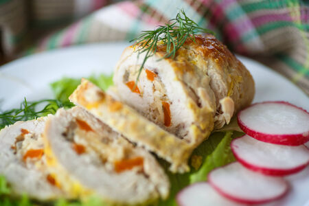 chicken roulade stuffed with meat on lettuceの写真素材