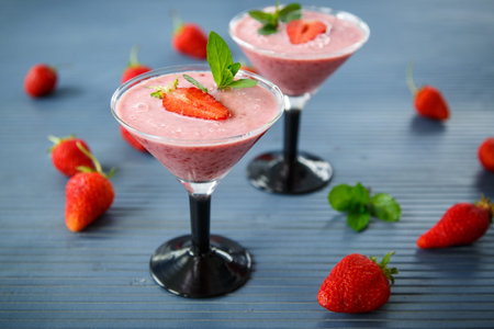 strawberry smoothie with mint in glasses on the tableの写真素材