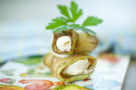 zucchini rolls with cheese filling with parsleyの写真素材