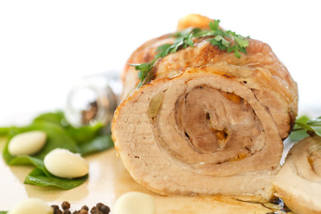 Meatloaf baked with garlic and spices on the table の写真素材