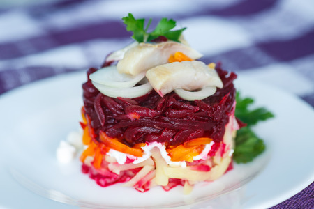 Russian traditional salad with herring and boiled vegetablesの写真素材