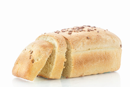 fresh homemade corn bread with seeds on a white background