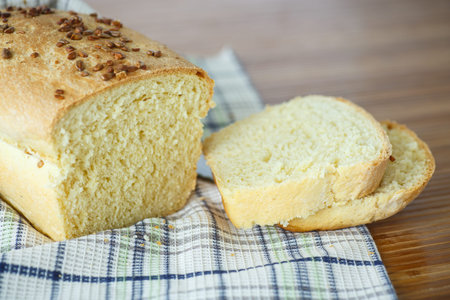 fresh homemade corn bread with seeds on a wooden table
