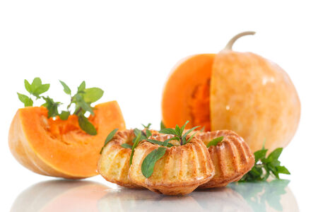 sweet muffins pumpkin with mint  on a white backgroundの写真素材