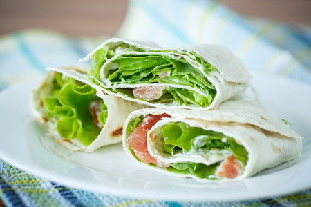 roll pita with salad and salted salmonの写真素材