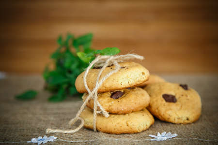 homemade cookies with chocolate chips in on a wooden tableの写真素材
