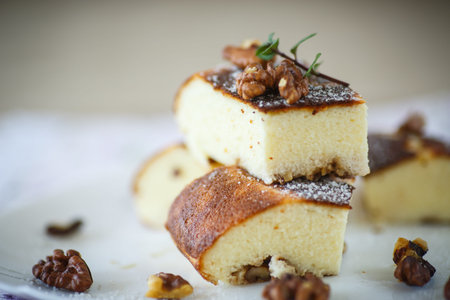 Cottage cheese casserole with walnuts on a plateの写真素材