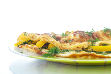 delicious omelet with peppers and herbs on a plate