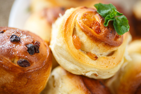 sweet rolls with raisins on the tableの写真素材