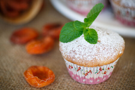 sweet muffins with dried apricots and sugarの写真素材