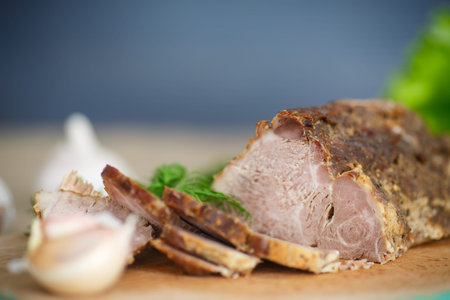 pork fillet baked with herbs and garlicの写真素材