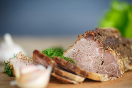 pork fillet baked with herbs and garlicの写真素材