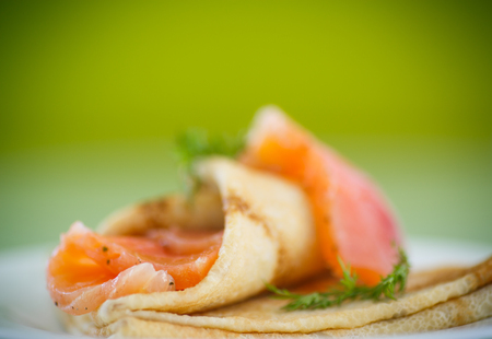 stack of pancakes with salted salmon on a plateの写真素材
