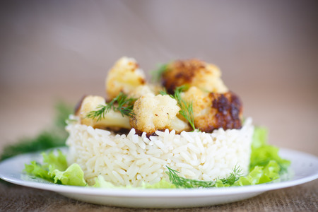 cauliflower fried with a side dish of boiled riceの写真素材