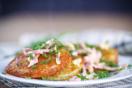 fried potato pancakes with sausage and cheeseの写真素材