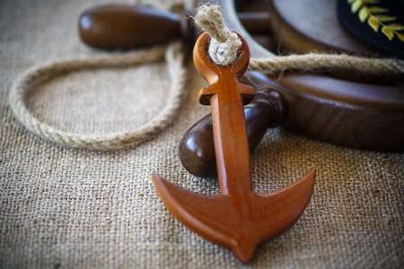 Decorative wooden ship anchored at the helm on the tableの写真素材