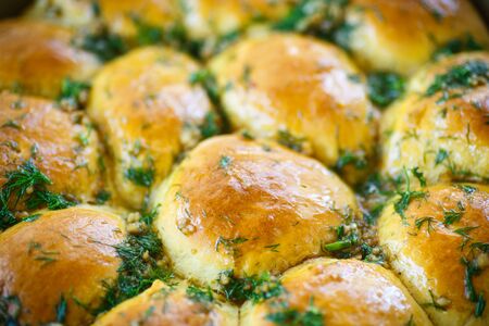 lush homemade buns with garlic and dillの写真素材