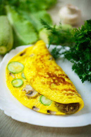 fried omelette with zucchini, eggplant and mushroomsの写真素材