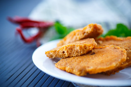 Fish eggs fried in batter on a plate