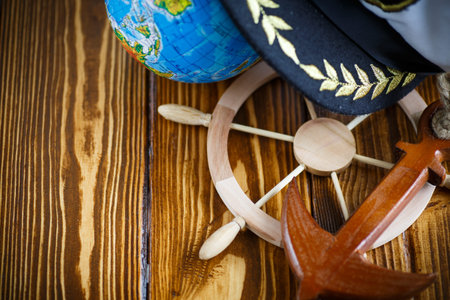 Decorative wooden steering wheel on an old wooden table