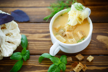 soup pureed cauliflower in a plate on the tableの写真素材