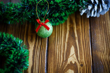 Christmas tree decorations on a wooden tableの写真素材