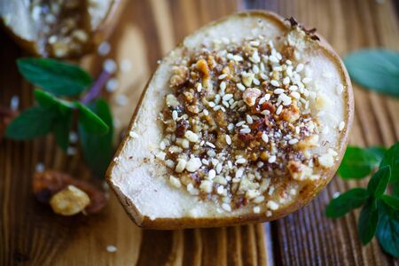 sweet pears baked with nuts and honeyの写真素材