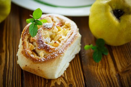 sweet rolls with quince in the tableの写真素材