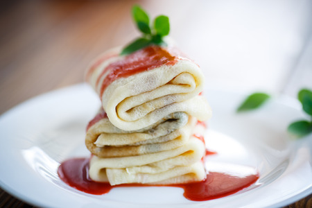 sweet pancakes with strawberry jam and mintの写真素材