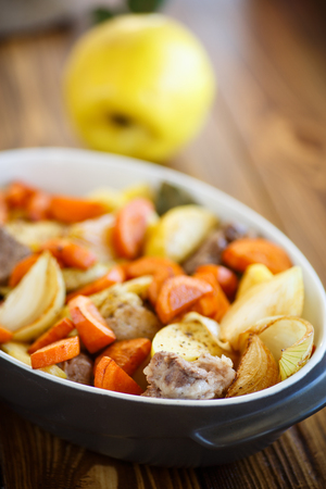 meat baked with quince and vegetablesの写真素材