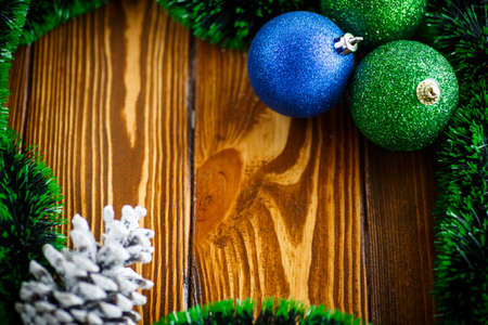 Christmas balls and ornaments on the wooden tableの写真素材