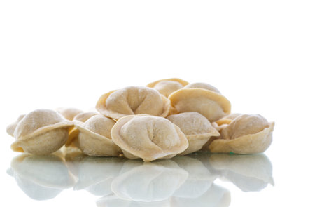 uncooked meat dumplings on a white backgroundの写真素材