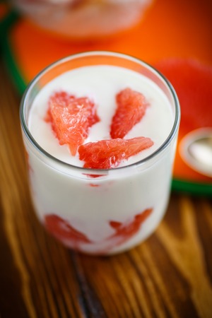 Greek yogurt with red grapefruit in a glassの写真素材