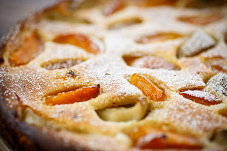 Cottage cheese casserole with apricots on a wooden tableの写真素材