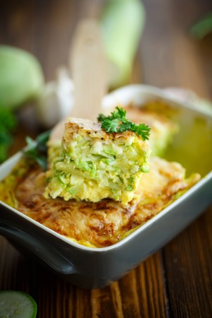 casserole with cheese and zucchini in baking dishの写真素材