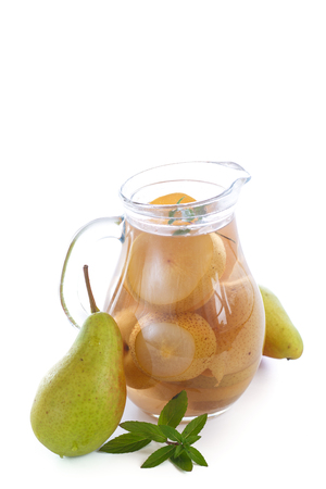 sweet pear compote in a decanter on a white backgroundの写真素材