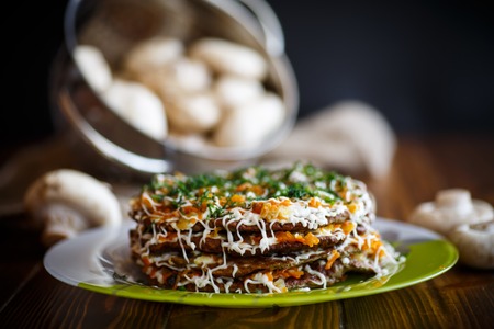 liver cake stuffed with vegetables on a dark wooden tableの写真素材