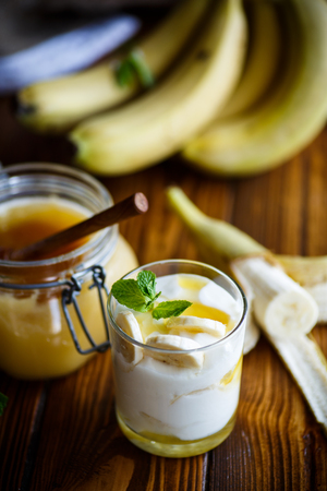 fresh homemade yogurt with bananas and honeyの写真素材