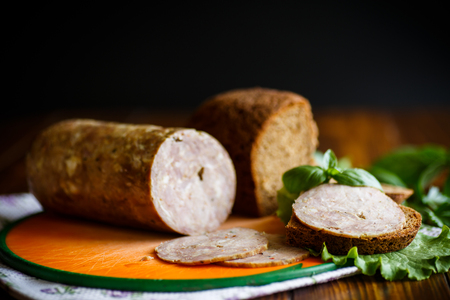 A sandwich with homemade sausage and rye breadの写真素材