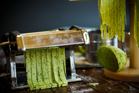 Homemade noodles green with greensの写真素材