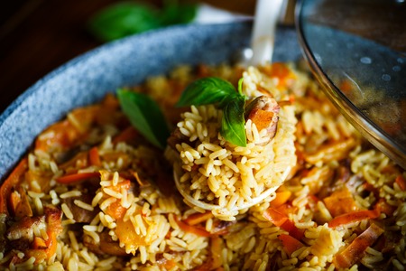 Pilaf with beef, carrots, onions, garlic, pepper and cumin.の写真素材