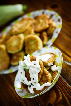 fried squash pancakes in a plateの写真素材
